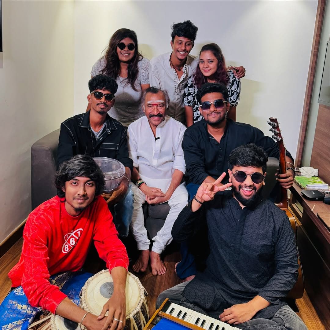 Office Gaana with composer Deva, seated around tabla, guitar and harmonium