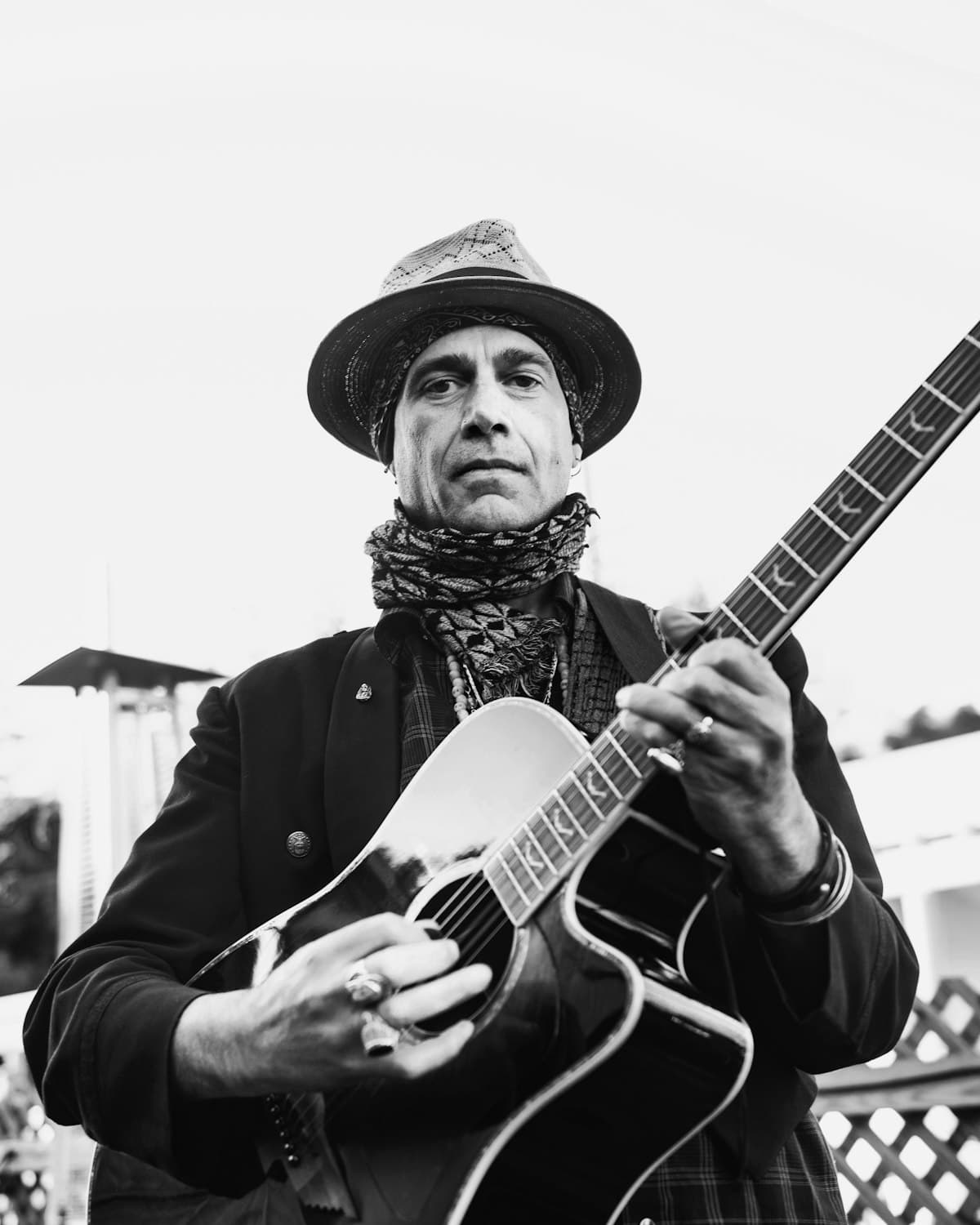 Black and white portrait of a guitarist